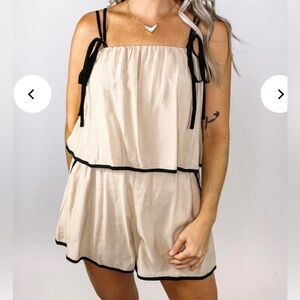 ***BLACK Entro Ruffle Romper with White Trim size L